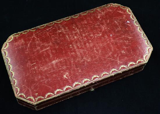 An Edwardian Cartier gilt tooled red leather jewellery box,